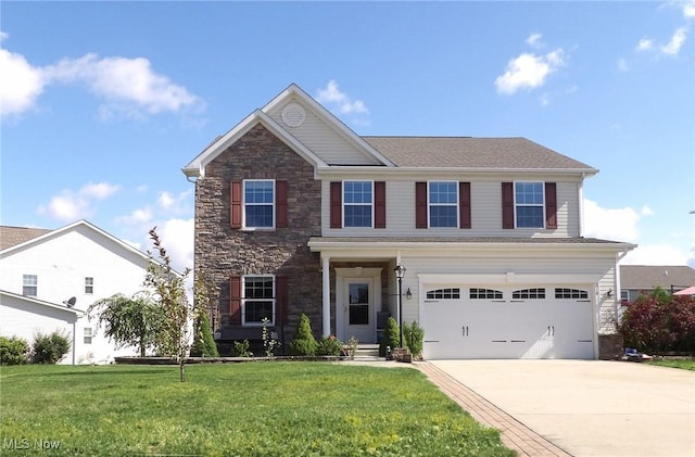 view of front of home with a garage, concrete driveway, stone siding, and a front yard