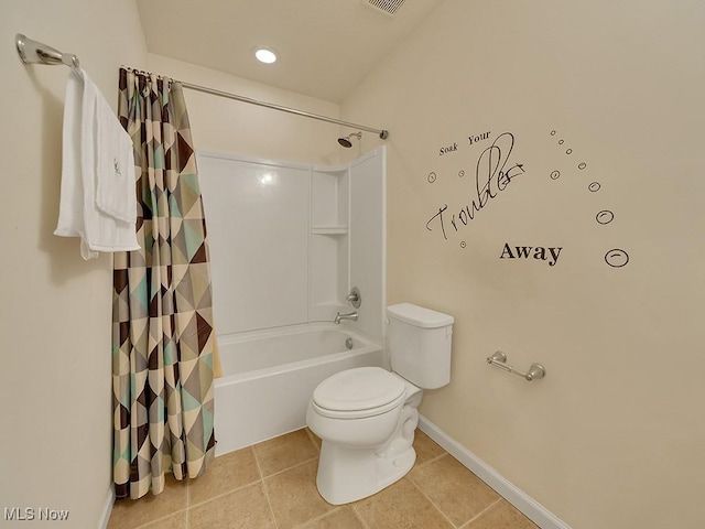 bathroom featuring visible vents, baseboards, toilet, tile patterned floors, and shower / bath combination with curtain