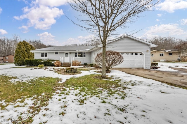 ranch-style house featuring driveway and an attached garage