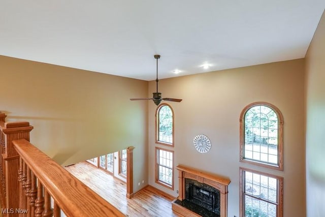 797 Chardoney Dr, Wadsworth, OH 44281 - interior space featuring a high ceiling, wood finished floors, ceiling fan, and a premium fireplace