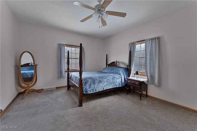 bedroom with carpet flooring, visible vents, and baseboards