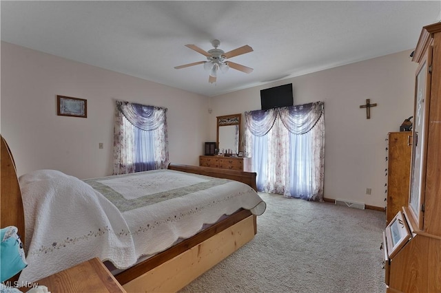 bedroom featuring carpet, visible vents, ceiling fan, and baseboards