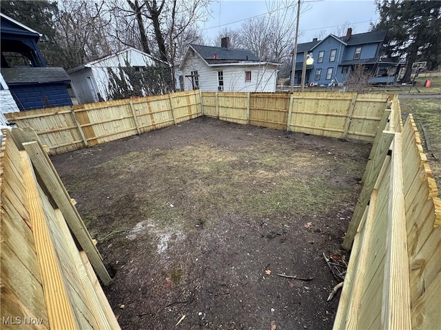 view of yard with fence and a residential view