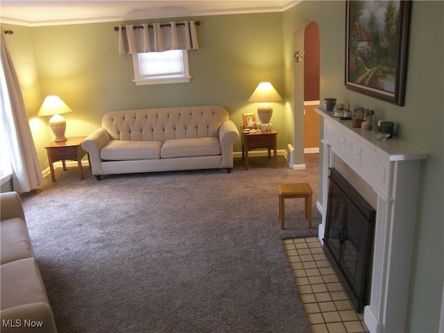 living area with arched walkways, a fireplace with flush hearth, light colored carpet, and ornamental molding