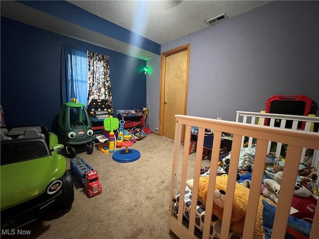 game room featuring carpet floors and visible vents