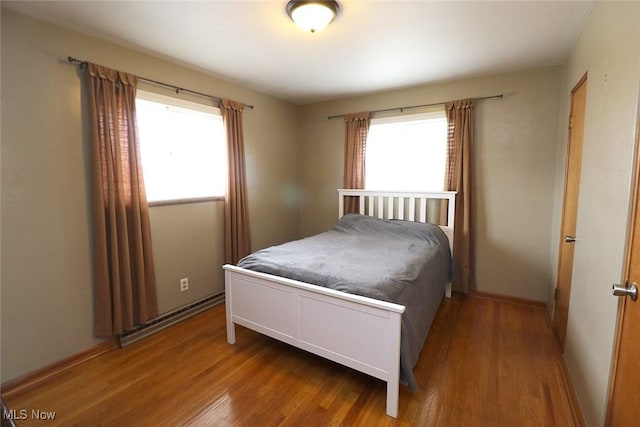 bedroom with wood finished floors