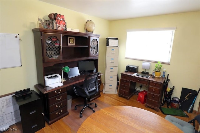 office space with wood finished floors