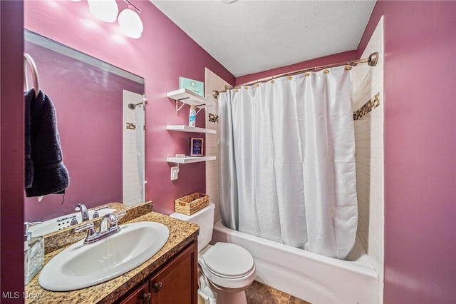 full bathroom featuring a textured ceiling, vanity, toilet, and shower / tub combo with curtain