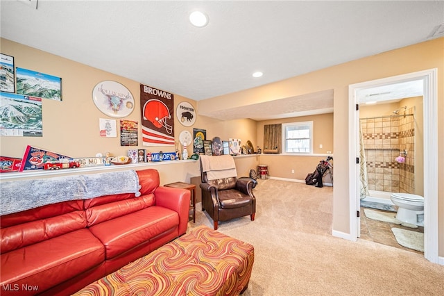 living room with carpet floors, recessed lighting, and baseboards