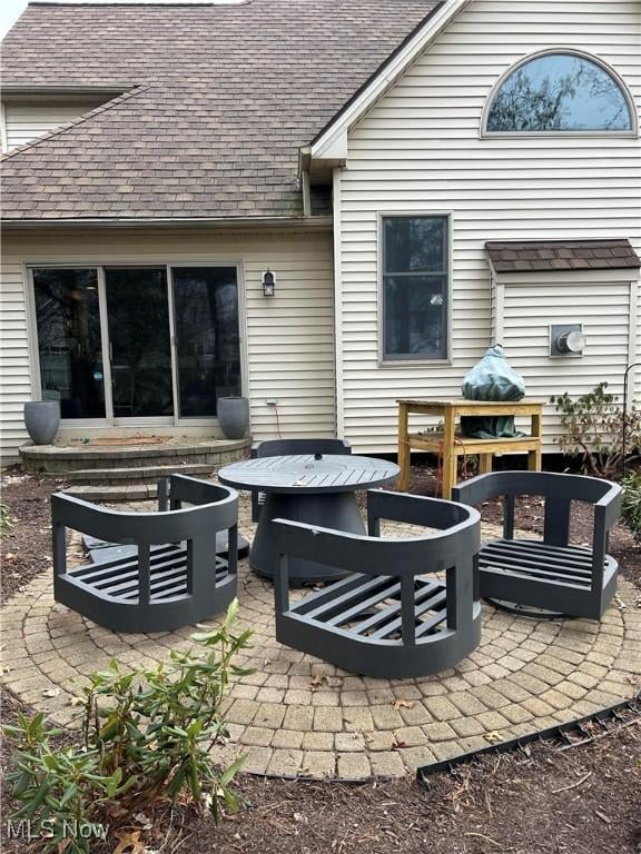 view of patio with a fire pit