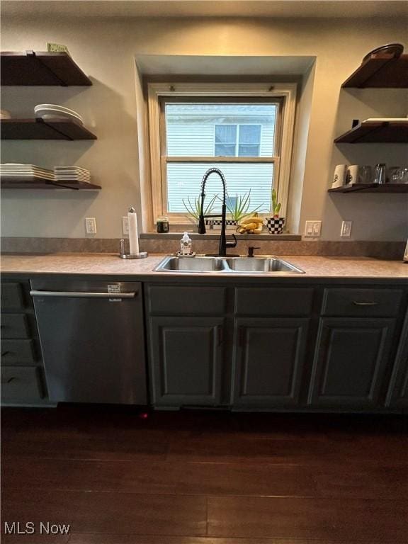 bar featuring dark wood finished floors, a sink, and dishwashing machine