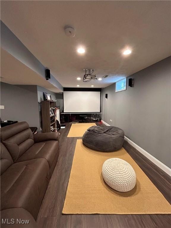 cinema with recessed lighting, baseboards, and wood finished floors