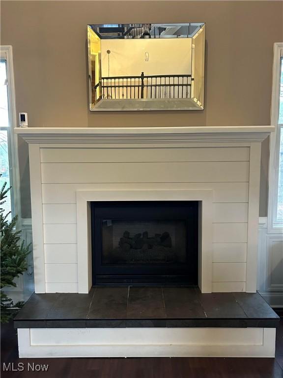 interior details featuring a fireplace with raised hearth