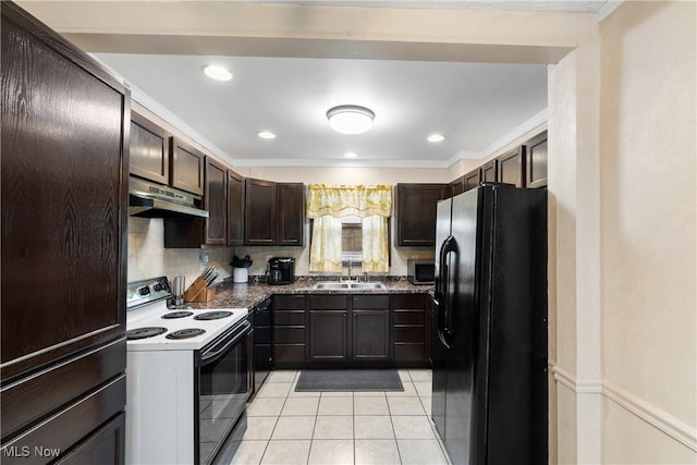 kitchen with light tile patterned floors, dark brown cabinetry, a sink, under cabinet range hood, and black appliances