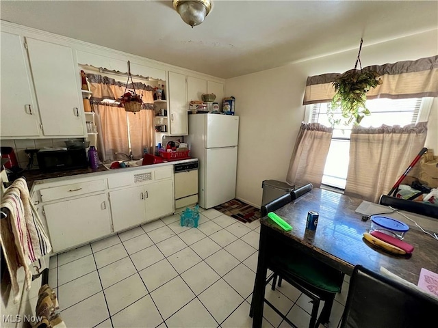 kitchen with open shelves, white appliances, light tile patterned floors, and white cabinets