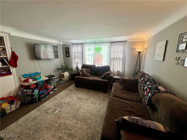 carpeted living room with ornamental molding