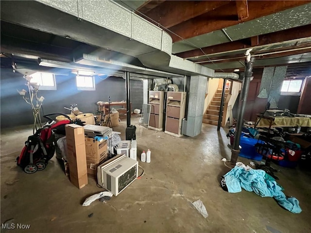 basement featuring stairs