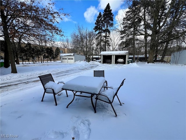 view of yard layered in snow