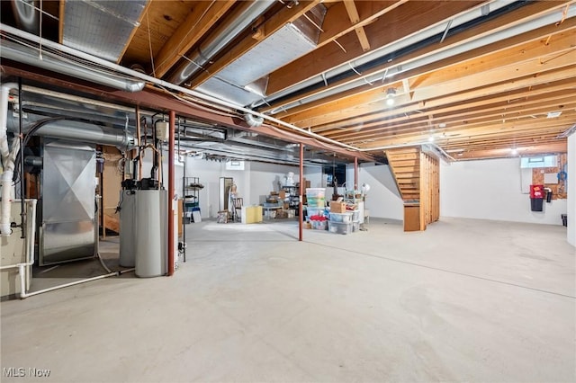 below grade area featuring gas water heater and heating unit