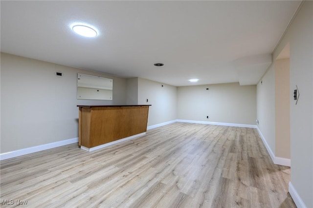 interior space with light wood-style flooring and baseboards