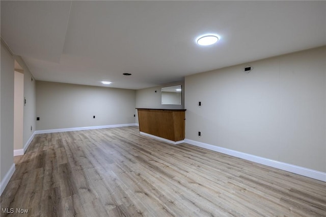 interior space featuring light wood-style floors and baseboards