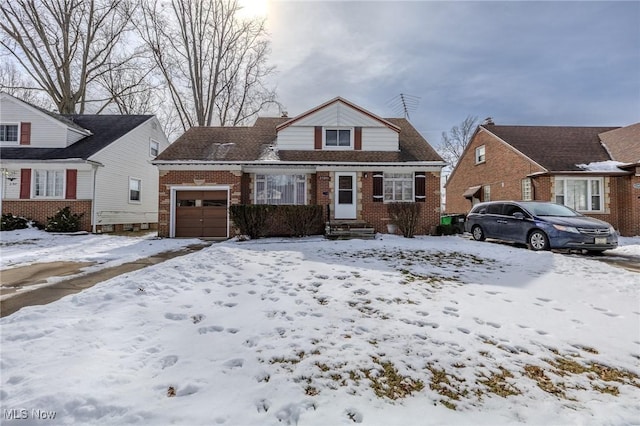 bungalow-style home featuring brick siding and an attached garage