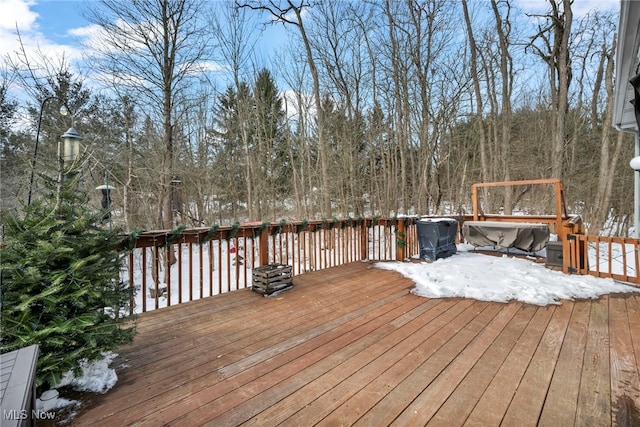 view of snow covered deck