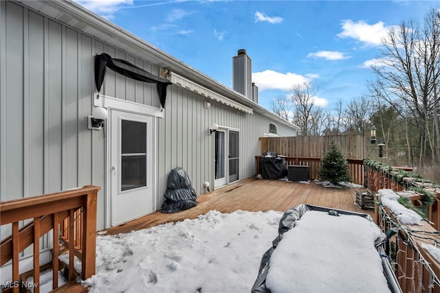 deck with central AC unit and fence