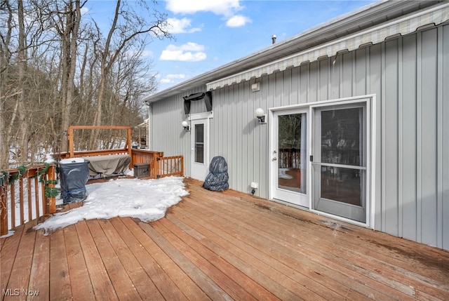 view of snow covered deck