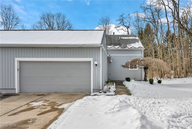 exterior space with driveway and an attached garage