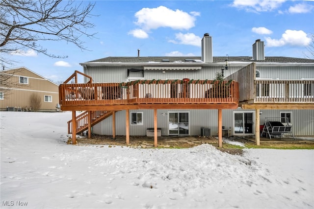 back of property featuring a wooden deck