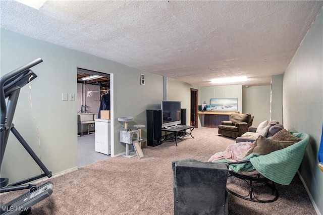 living area featuring light carpet, baseboards, and a textured ceiling