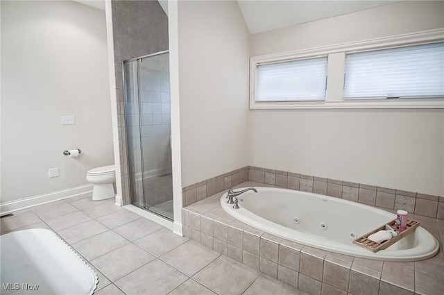 full bath featuring a stall shower, a tub with jets, toilet, and tile patterned floors