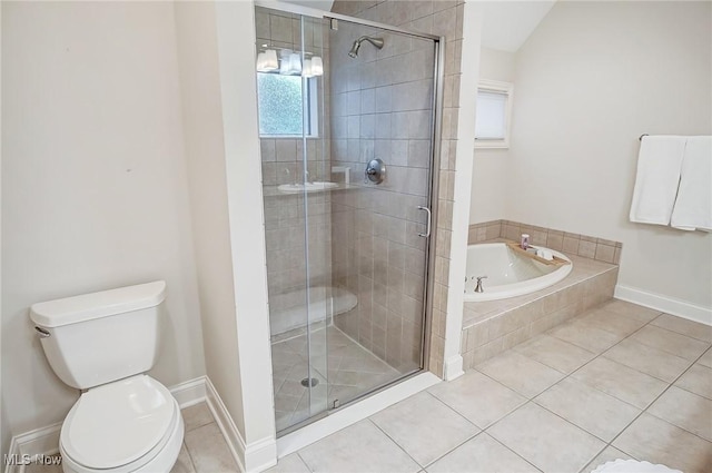 bathroom with a garden tub, tile patterned flooring, and a shower stall