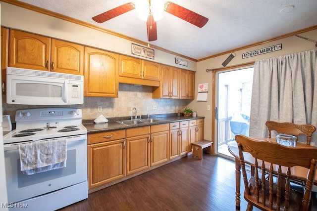 kitchen with white appliances, dark wood-style flooring, a sink, ornamental molding, and decorative backsplash