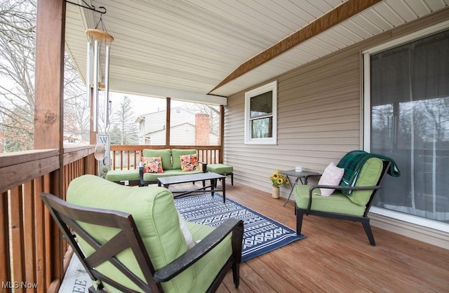 wooden terrace featuring an outdoor hangout area