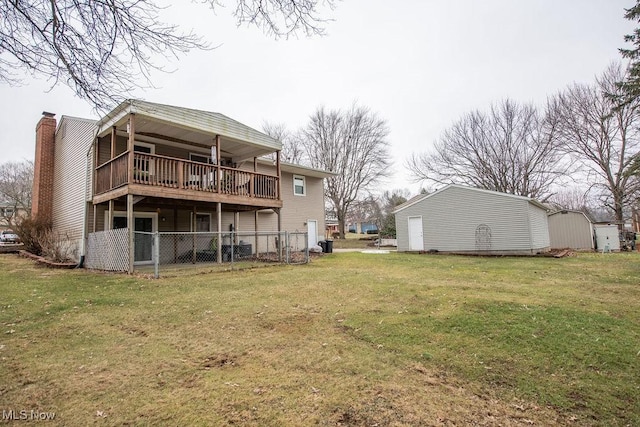 back of property featuring a lawn and a chimney