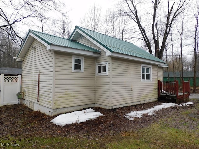 view of home's exterior with metal roof