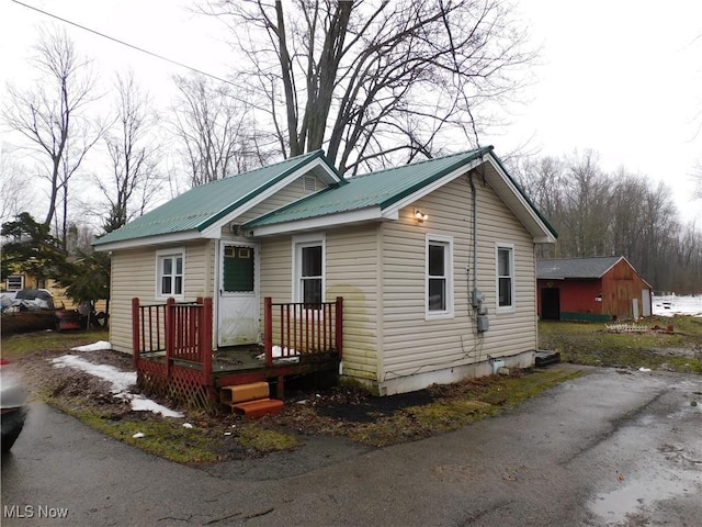 bungalow-style house with metal roof