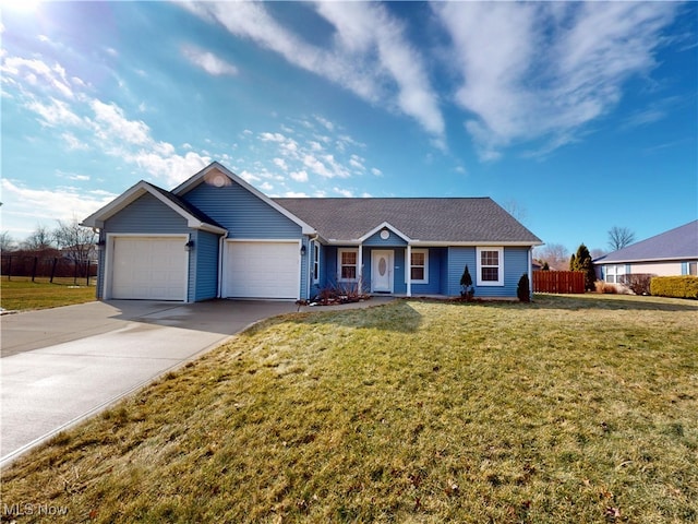 ranch-style home with a garage, fence, a front lawn, and concrete driveway