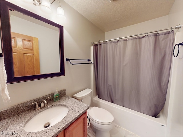 bathroom featuring shower / tub combo with curtain, a textured ceiling, toilet, and vanity