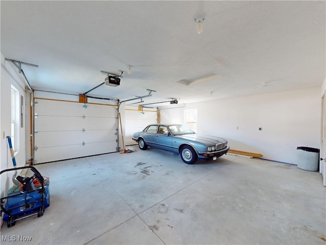 garage featuring a garage door opener