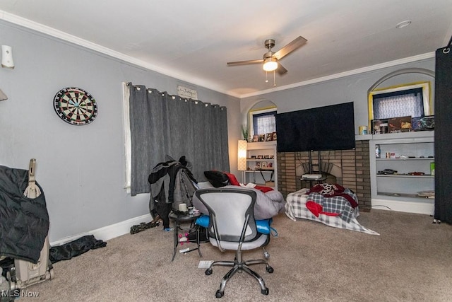 bedroom featuring baseboards, carpet floors, a ceiling fan, and crown molding