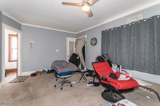 sitting room with ornamental molding, carpet flooring, and baseboards