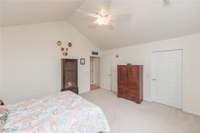 bedroom with light carpet, visible vents, a ceiling fan, and lofted ceiling