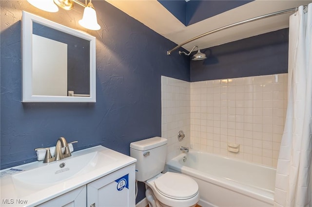 full bathroom with shower / bath combo, a textured wall, vanity, and toilet