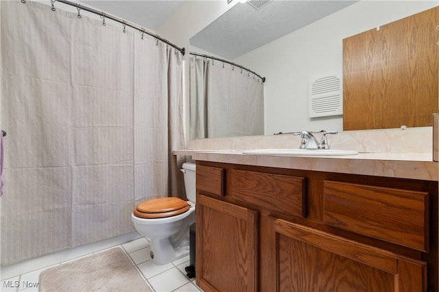 full bath with a shower with curtain, visible vents, toilet, vanity, and tile patterned flooring