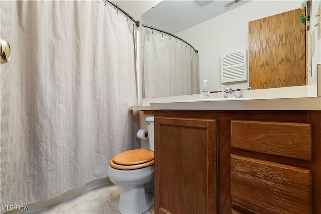 bathroom featuring visible vents, a shower with shower curtain, toilet, vanity, and tile patterned floors