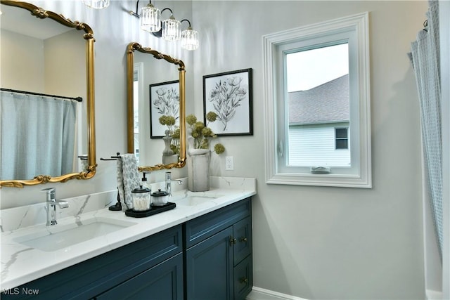 full bath with a sink and double vanity