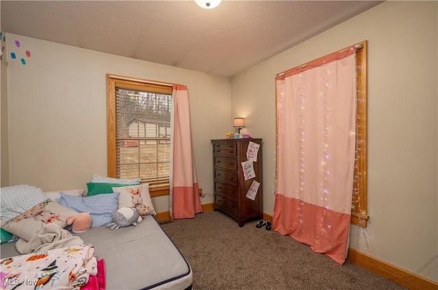 carpeted bedroom with baseboards